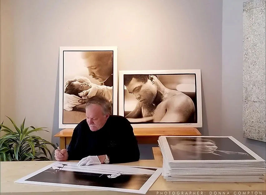 A man sitting at a table with some papers